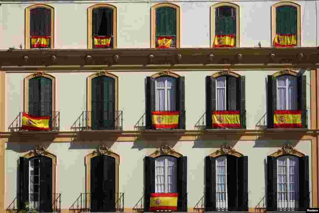 Spanish flags are seen on balconies in Malaga, Spain. The country is seeing displays of unity as Catalonia’s separatist leaders are threatening to issue a declaration of independence on the back of last Sunday’s unauthorized plebiscite.