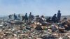 Badobha ukudla lokunye eNgozi Mine Dumpsite koBulawayo.