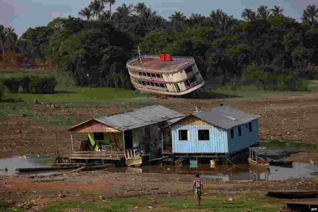 A boat is stranded on the Rio Negro, in the Cacau Pirera District, in Iranduba, Amazonas, Brazil, Sept. 25, 2023. The Government of Amazonas declared a State of Environmental Emergency on Sept. 12 due to the high number of fires and a strong drought in the rivers, affecting navigation and food distribution to the interior of the state. 