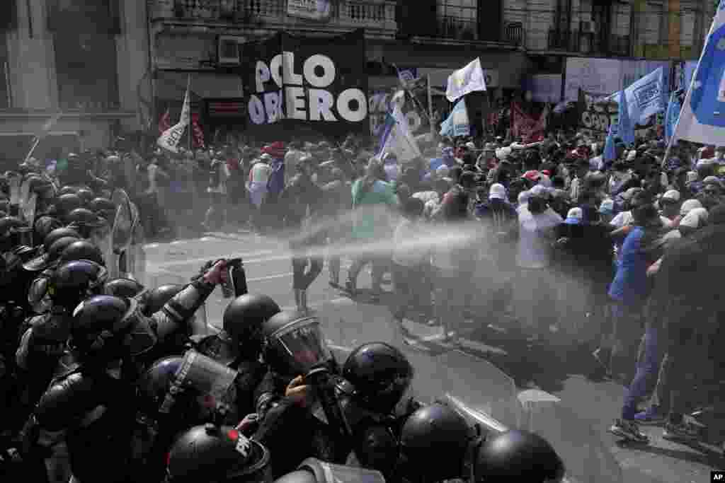 Police block an anti-government demonstration against food scarcity at soup kitchens and economic reforms proposed by President Javier Milei in Buenos Aires, Argentina.