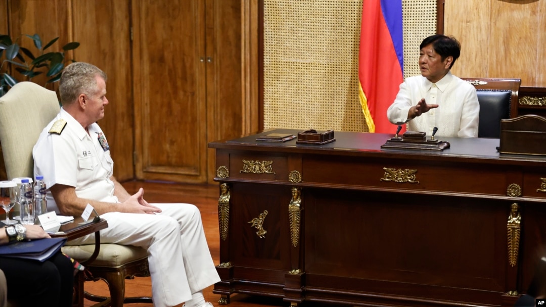 United States Indo-Pacific Command (INDOPACOM) commander Admiral Samuel Paparo is greeted by Philippine President Ferdinand Marcos Jr. during a courtesy visit inside Malacanang presidential palace in Manila, Aug. 27, 2024. 