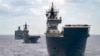 FILE - In this photo undated photo provided by the Australian Defense Force, Royal Australian Navy Ships Canberra, Supply and Warramunga sail in formation with 37 ships during Exercise Rim of the Pacific 2022. 