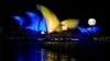 The sails of the Opera House are illuminated with the colors of Ukraine's national flag in solidarity with the country's people and government as the country is being invaded by Russia in Sydney, Australia, Feb. 28, 2022.