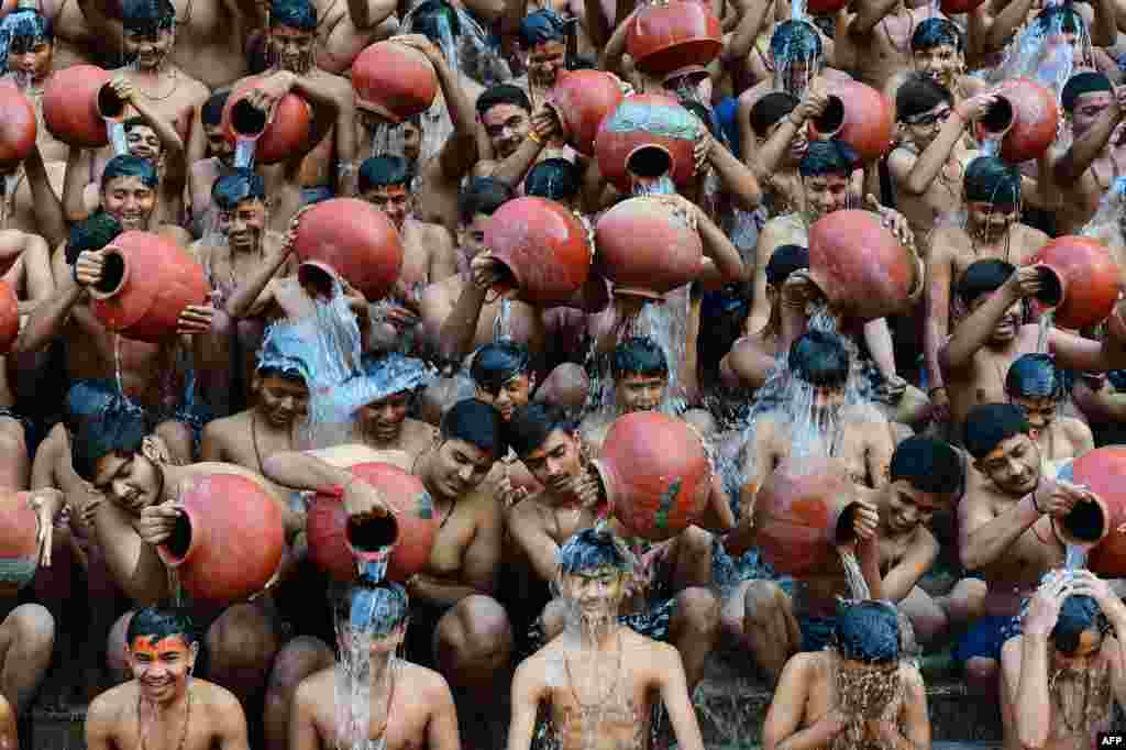 Students from the Swaminarayan Gurukul school take part in a 'Magh Snan' or holy bath in Ahmedabad, India.