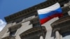 FILE - A Russian flag flies outside the Consulate General of the Russian Federation in New York in Manhattan, New York City, Aug. 2, 2021. 