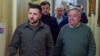In this image provided by the Ukrainian Presidential Press Office, Ukrainian President Volodymyr Zelenskyy, left, and U.N. Secretary-General Antonio Guterres walk in a hallway during their meeting in Kyiv, Ukraine, April 28, 2022.