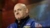 FILE - NASA astronaut Scott Kelly listens to a question about his scheduled mission aboard the International Space Station during a briefing at Johnson Space Center in Houston, Dec. 5, 2012.
