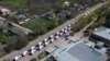 FILE - This video grab taken from a handout footage released by the Russian Defense Ministry on May 2, 2022 shows civilians being evacuated from an area near the Azovstal steel plant in Mariupol.