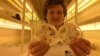FILE - Professor Wendy Harwood poses for a photograph in a plant breeding incubator room with barley plants that have undergone gene editing at the John Innes Center in Norwich, Britain, May 25, 2016. 