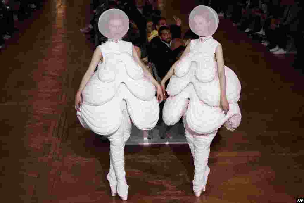 Models present creations by Thom Browne during the women's 2018 Spring/Summer ready-to-wear collection fashion show in Paris, France.