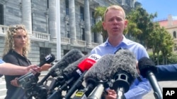 FILE - Chris Hipkins talks to reporters outside parliament in Wellington, New Zealand, Jan. 21, 2022. Since the photo was taken, he has become New Zealand's prime minister.