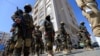 Forces loyal to Yemen's Houthi rebels take part in a military parade marking the seventh anniversary of the Saudi-led coalition's intervention in their country, in the capital Sanaa, March 31, 2022. Yemen's warring sides reportedly have accepted a two-month truce. 