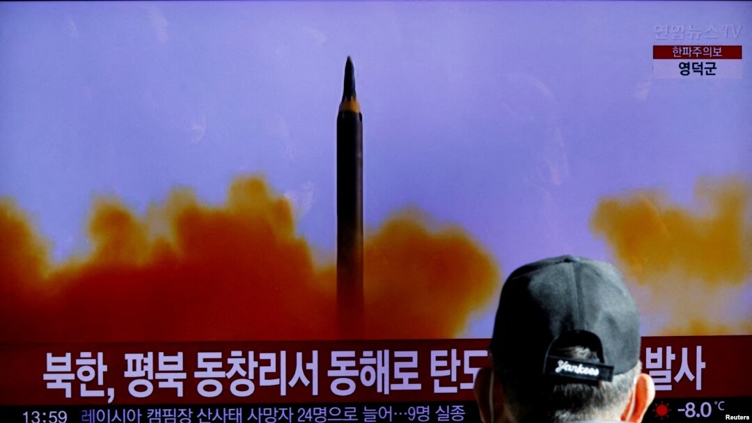 FILE - A man in Seoul, South Korea, watches a TV broadcasting a news report about North Korea firing a ballistic missile on Dec. 18, 2022. 