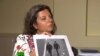 RT Editor-in-Chief Margarita Simonyan shows an image of two men during an interview with Anatoliy Chepiga (aka Ruslan Boshirov) and Dr. Alexander Mishkin (aka Alexander Petrov), suspected of poisoning former GRU officer Sergei Skripal and his daughter Yulia in Salisbury, England.