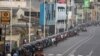 FILE - Three-wheelers queue to buy petrol due to fuel shortage, amid the country's economic crisis, in Colombo, Sri Lanka, July 5 2022.