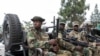 FILE PHOTO: M23 rebels escort FDLR to Rwandan border for repatriation after capture in Goma