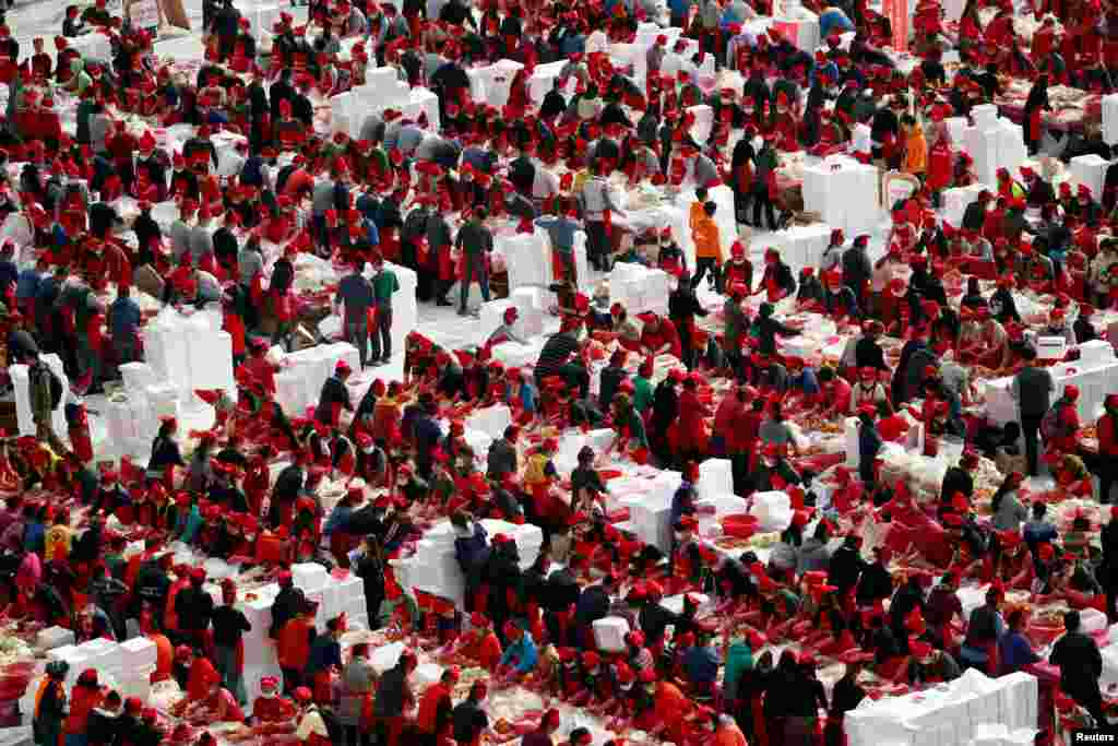 People take part in the Seoul Kimchi Festival in central Seoul, South Korea.