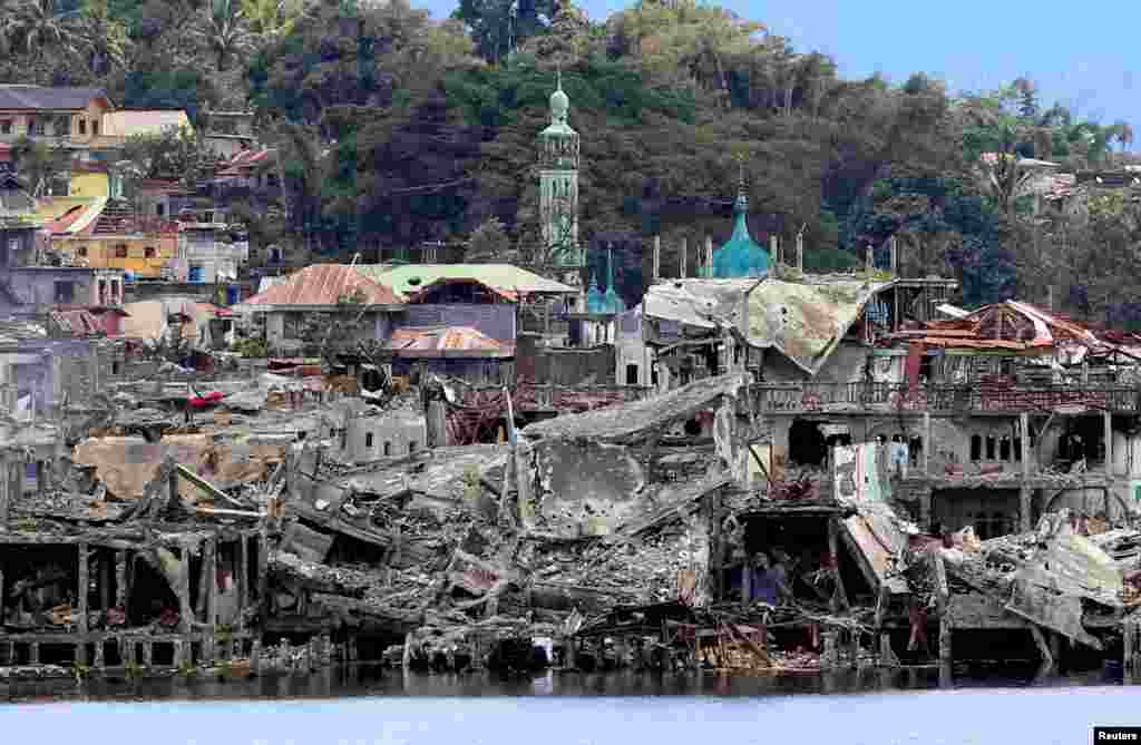 Damaged buildings are seen inside a war-torn area in Marawi City, southern Philippines after the country announced the end of five months of military operations in a southern city held by pro-Islamic State rebels.
