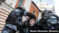 RUSSIA – Law enforcement officers detain a man after a rally demanding authorities allow opposition candidates to run in the upcoming municipal election in Moscow, Russia August 10, 2019.
