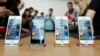 FILE - The iPhone SE is seen on display during an event at the Apple headquarters in Cupertino, California, March 21, 2016. 