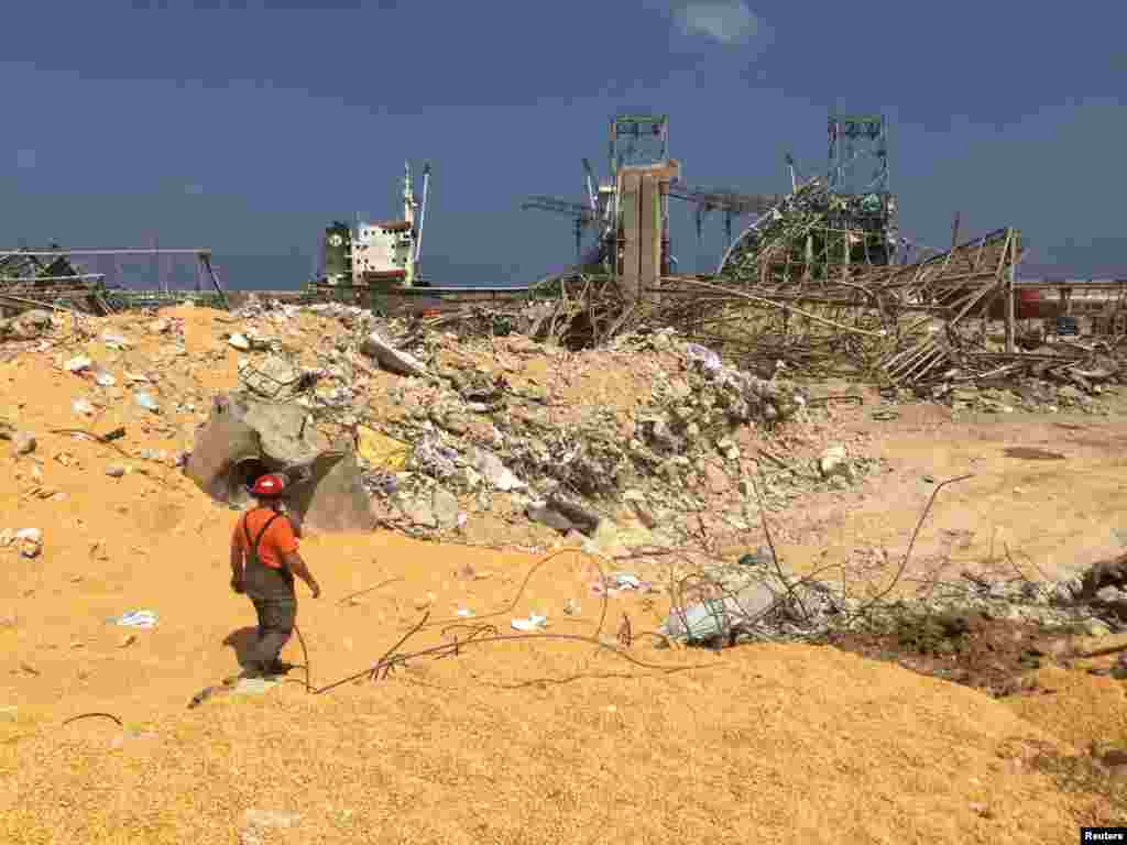 A man walks near rubble at the site of Tuesday&#39;s blast, at Beirut&#39;s port area, Lebanon.