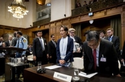 Myanmar State Counselor Aung San Suu Kyi (C) arrives for the second day of hearings on the Rohingya genocide case before the International Court of Justice at The Hague, The Netherlands, on Dec. 11, 2019.