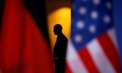 A member of a security detail keeps watch as President Barack Obama and Chancellor Angela Merkel meet in the German Chancellery in Berlin, Germany on November 17, 2016.