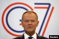 European Council President Donald Tusk speaks during a news conference on the margins of the G7 summit.