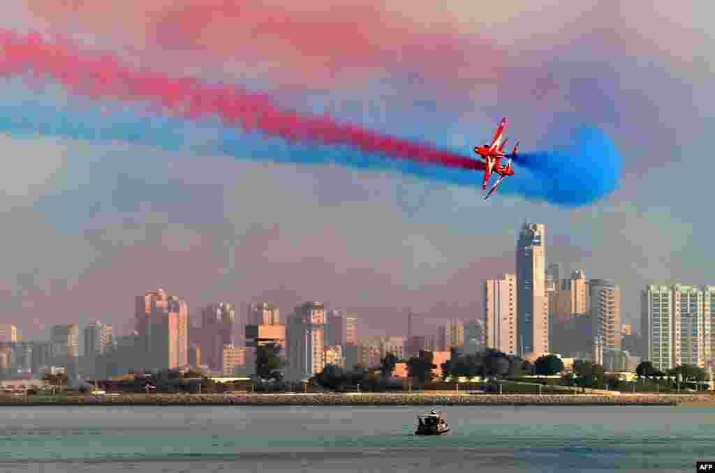 The British Royal Air Force's (RAF) aerobatic team, the "Red Arrows", performs aerial maneuvers during an airshow in Kuwait City.