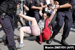 RUSSIA – Police officers detain people during an rally in the center of Moscow, July 27, 2019