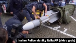 An AP video grap showing the air-to-air missile Italian police seized in a raid on far-right extremists on July 15, 2019.