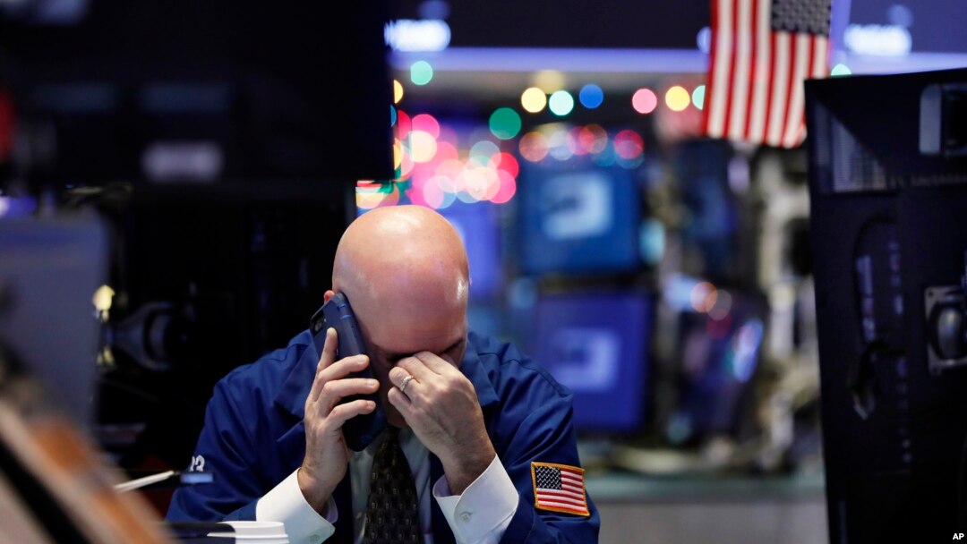 A trader talks on his phone on the floor of the New York Stock Exchange, Jan. 2, 2019. 