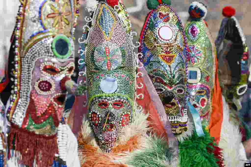Dancers, known as "Kukeri", perform during the International Festival of the Masquerade Games in Pernik, near Sofia, Bulgaria.