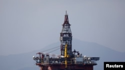 FILE - An oil platform operated by China National Offshore Oil Corporation (CNOOC) is seen in the sea off China's southernmost Hainan province, March 23, 2018.