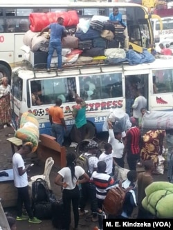 FILE - People escape from Kumba, an English-speaking town in southwestern Cameroon, Sept. 11, 2018.