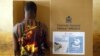 FILE - Angolan President Jose Eduardo dos Santos attends a party central committee meeting in Luanda, Dec. 2 ,2016. He is stepping down after 38 years in power.