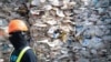 FILE - A container is filled with plastic waste from Australia, in Port Klang, Malaysia, May 28, 2019.