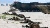 LITHUANIA -- NATO troops take part in a massive amphibious landing during the Exercise Baltic Operations (BALTOPS), a NATO maritime-focused military multinational exercise, in Nemirseta on the Baltic sea, June 4, 2018