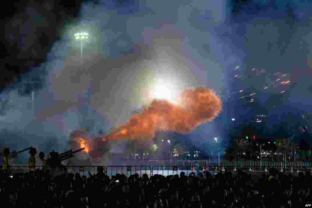 Artillery guns are fired near the cremation grounds where the body of the late Thai King Bhumibol Adulyadej iss taken to be cremated after his funeral procession in Bangkok.