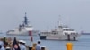 FILE - The U.S. Coast Guard National Security Cutter Bertholf (WMSL 750), left, and the Philippine Coast Guard ship BRP Batangas arrive, May 15, 2019, in Manila, Philippines, after taking part in a joint exercise off the South China Sea.