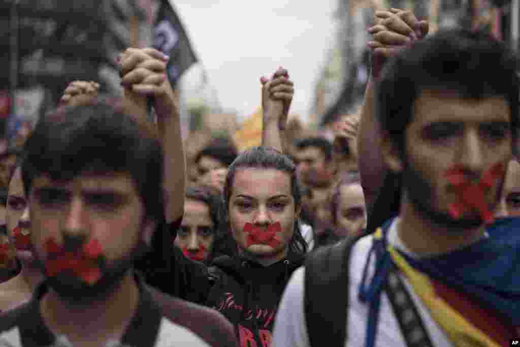Independence supporters march during a demonstration downtown Barcelona, Spain. Catalan leaders accused Spanish police of brutality and repression while the Spanish government praised the security forces for behaving firmly and proportionately.