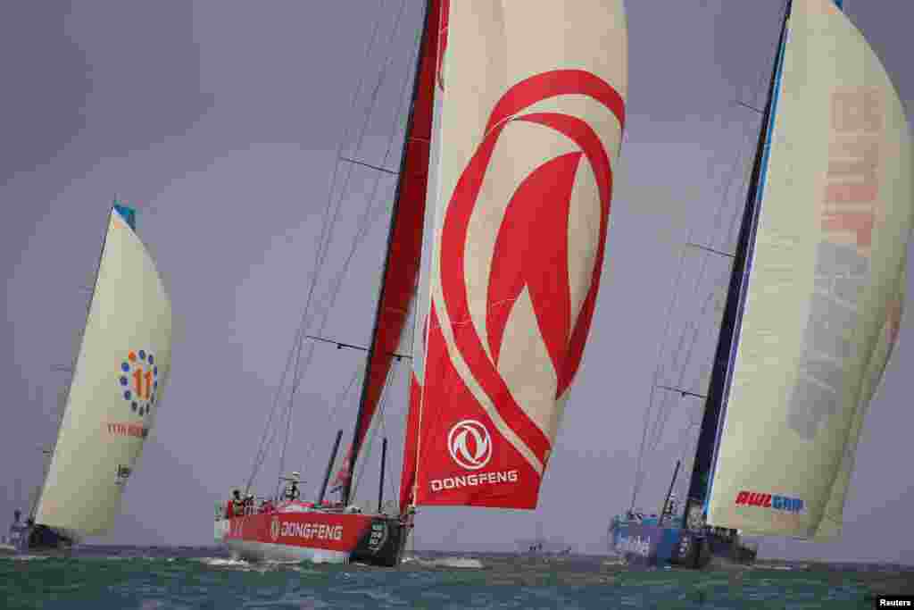 The Dongfeng Race Team and Team AkzoNobel sail during the In-Port Race, Volvo Ocean Race Team Vestas 11th Hour Racing, in Lisbon, Portugal.