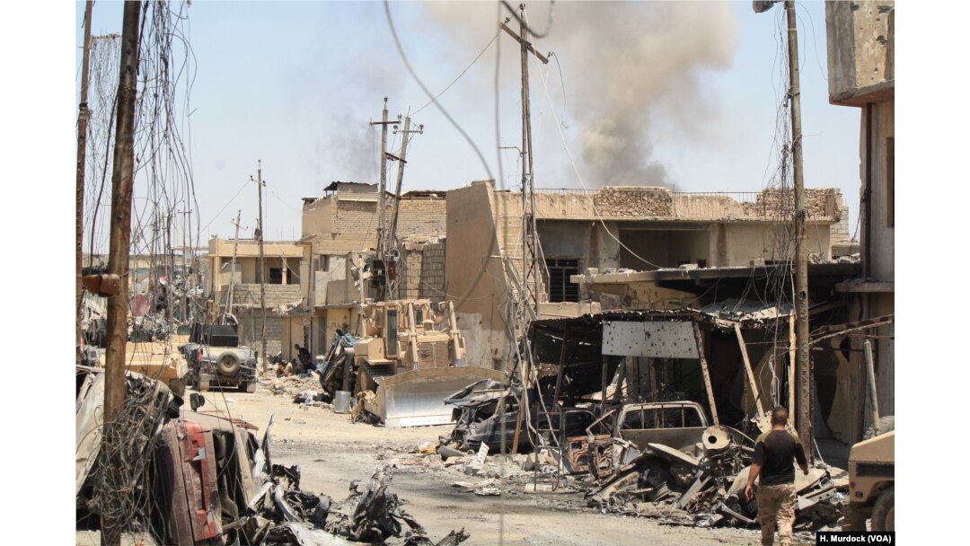 After Iraqi forces force IS out of an area, homes and cars are often destroyed and IS mortars continue to fall in Mosul, June 4, 2017.