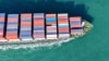 资料照片: 2025年1月13 日满载集装箱的货船驶出中国东部山东省青岛港。