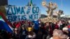 Protesters call for the removal of president Jacob Zuma in a march on Parliament in Cape Town, South Africa, Monday, Aug. 7, 2017. South Africa's parliament will vote by secret ballot on a motion of no confidence on South African President Jacob Zuma on Tuesday, the legislative body's speaker announced Monday. 