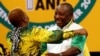 Deputy president of South Africa Cyril Ramaphosa greets an ANC member during the 54th National Conference of the ruling African National Congress (ANC) at the Nasrec Expo Center in Johannesburg, South Africa, Dec. 18, 2017.