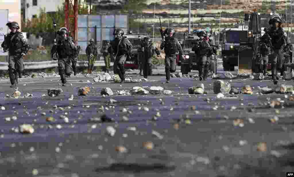 Israeli security forces clash with Palestinian protesters in the West Bank city of Ramallah as demonstrations continue to flare in the Middle East and elsewhere over U.S. President Donald Trump's declaration of Jerusalem as Israel's capital.