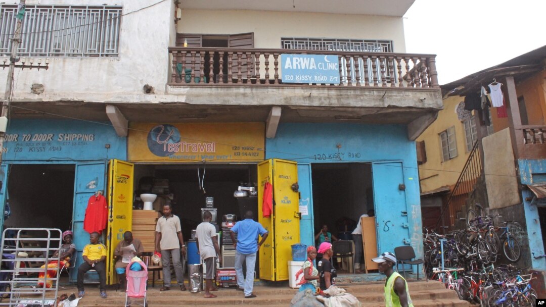 The Arwa clinic, center, that was closed after the clinic Doctor got infected by the Ebola virus in the capital city of Freetown, Sierra Leone, July 15, 2014..