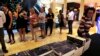 People queue to buy the newly published book by investigative journalist Jacques Pauw, at the launch of The President's Keepers, in Johannesburg, Nov. 8, 2017. 