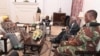 President Robert Mugabe, center, in a meeting with the ZDF Commander General Constantino Chiwenga, South African Minister of Defense Nosiviwe Mapisa-Nqakula (in yellow head wear), Zimbabwe Defense Minister Dr Sydney Sekeramayi and Zimbabwe State Security Minister Cde Kembo Mohadi at State House in Harare, Zimbabwe, Nov. 16, 2017. 